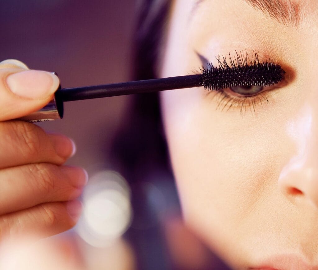 Close-up of Benefit They’re Real! Magnet Mascara being applied to eyelashes for extreme length and lift