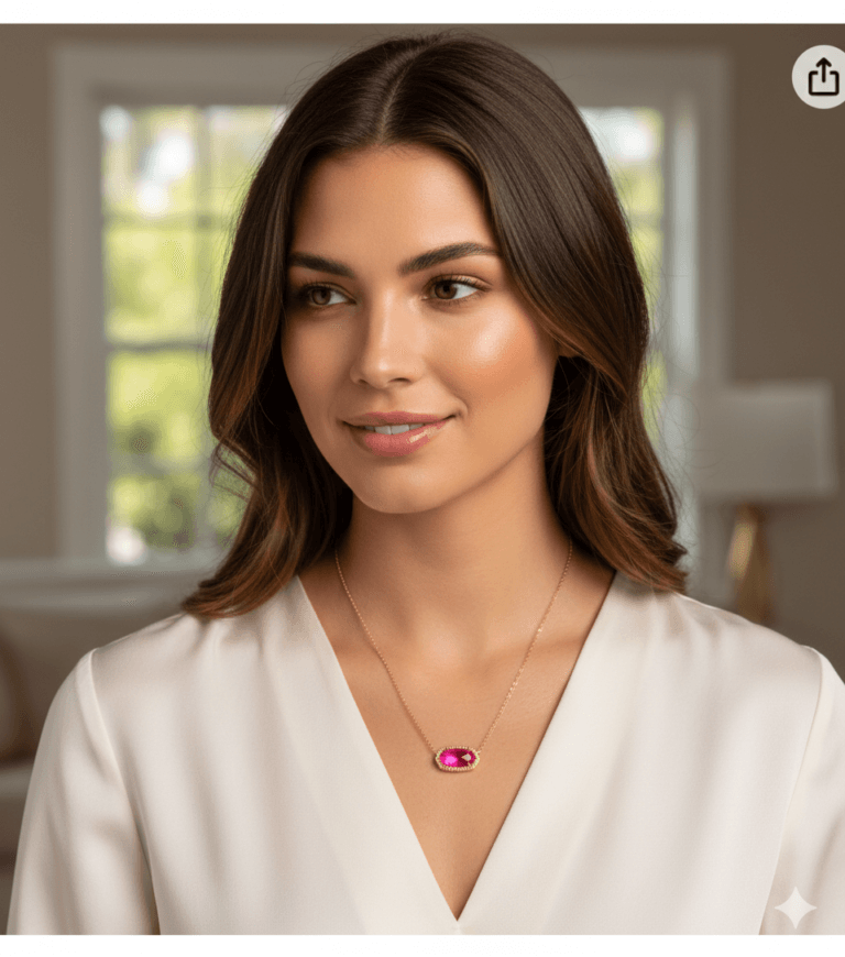 A woman wearing the Kendra Scott Elisa Pendant Necklace in 14k gold-plated with a vibrant pink gemstone centerpiece