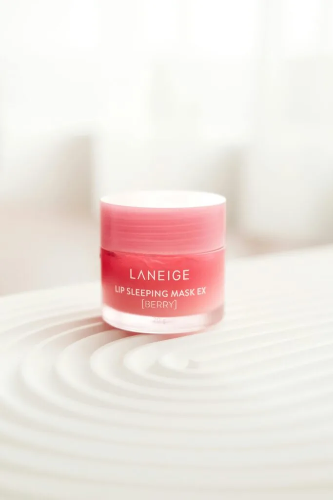 Laneige Lip Sleeping Mask Berry version on a modern aesthetic background, a top-selling overnight lip treatment for hydration.