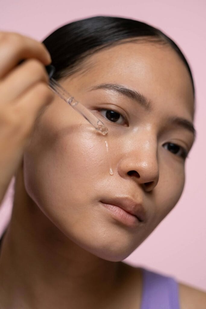 woman applying serum for glass skin at home
